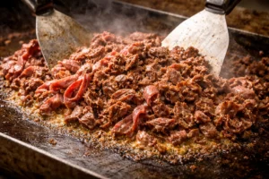 Thinly Sliced Beef Gets Chopped on the Grill